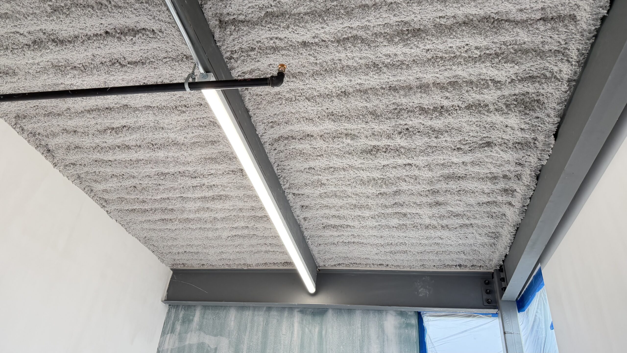 K13 Application of Insulation on a Commercial Building